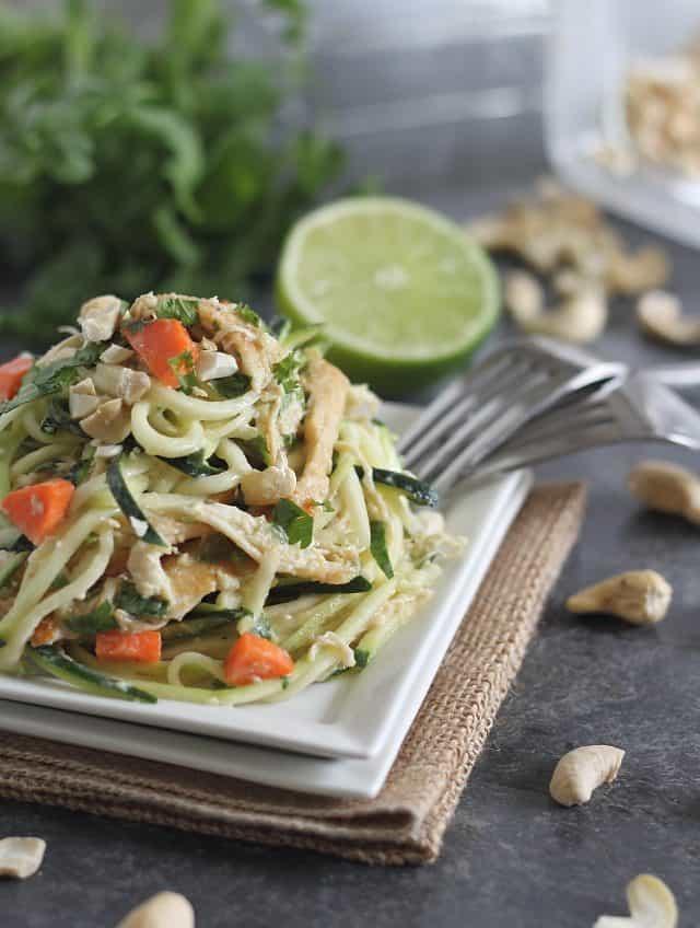Zucchini noodles are tossed in a flavorful Thai peanut sauce with shredded chicken for a healthier spin on classic Thai noodles.