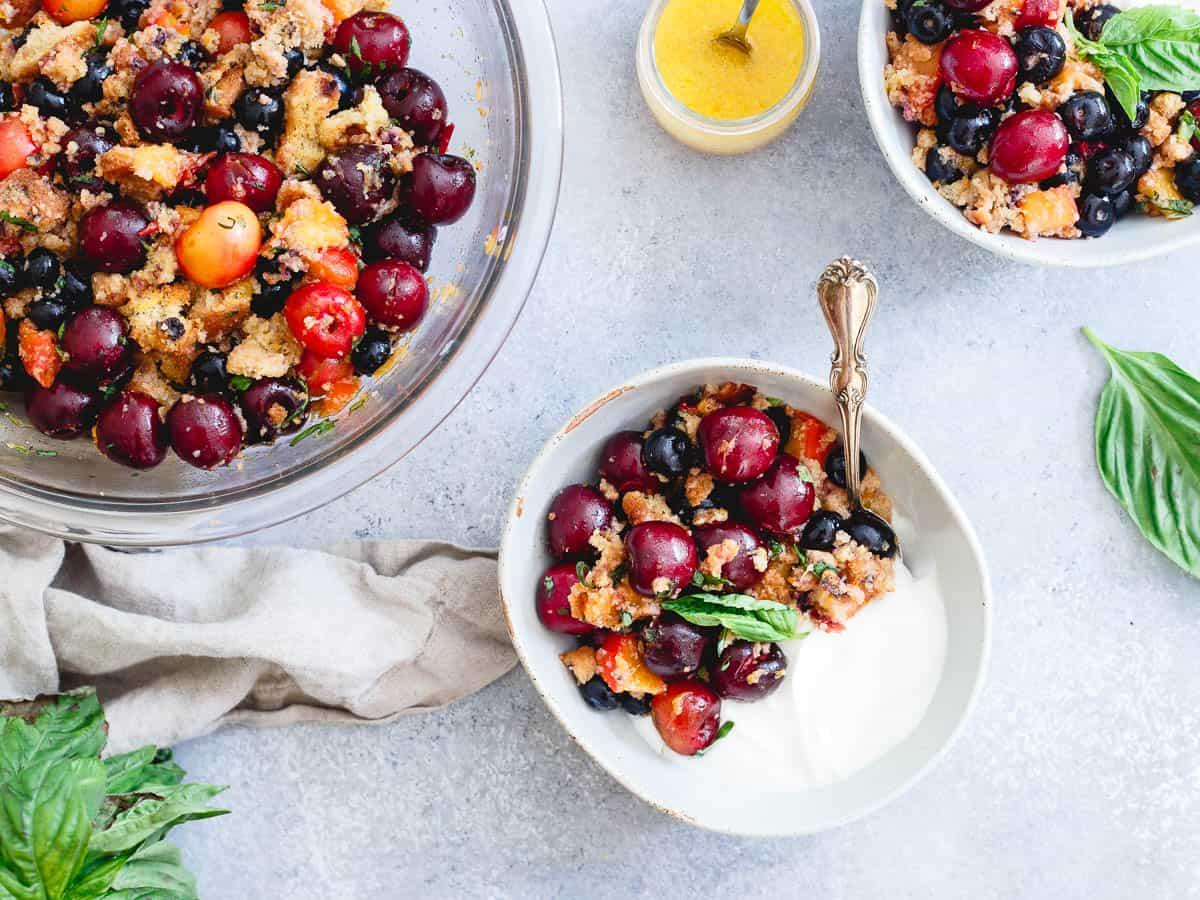 A sweet citrus dressing and fresh basil and mint bring together the sweet vibrant flavors in this summer fruit panzanella.