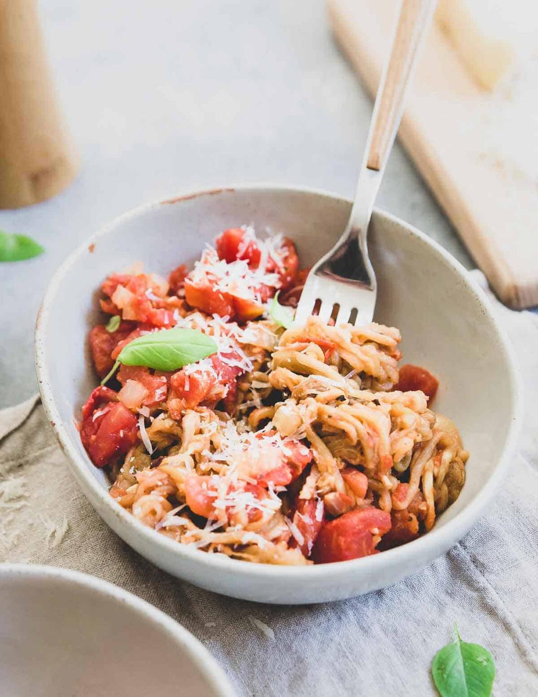Spiralized eggplant is a lower carb alternative to pasta in this easy meatless meal.