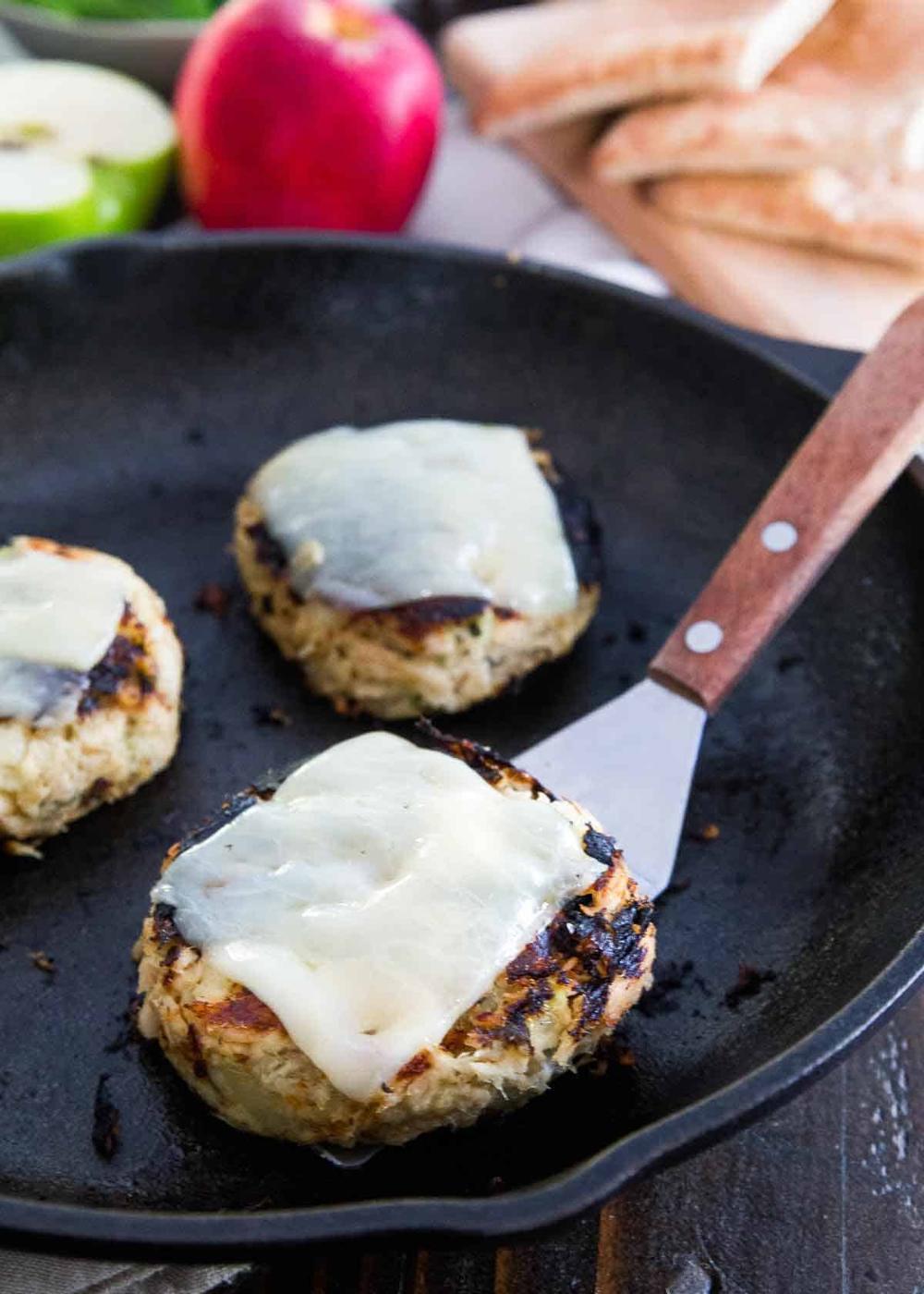 Tuna patties topped with cheddar cheese and filled with apples and dijon mustard.
