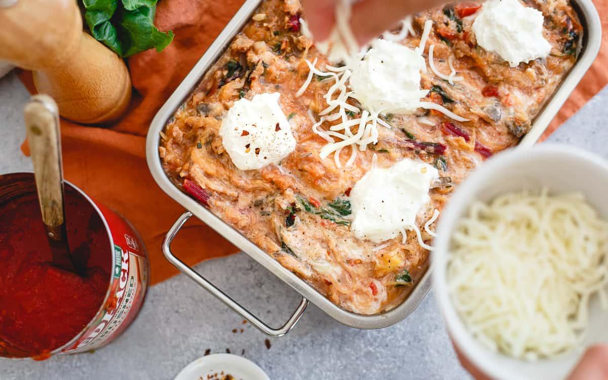 Spaghetti squash baked ziti is still as cheesy, hearty and delicious as the traditional Italian dish.