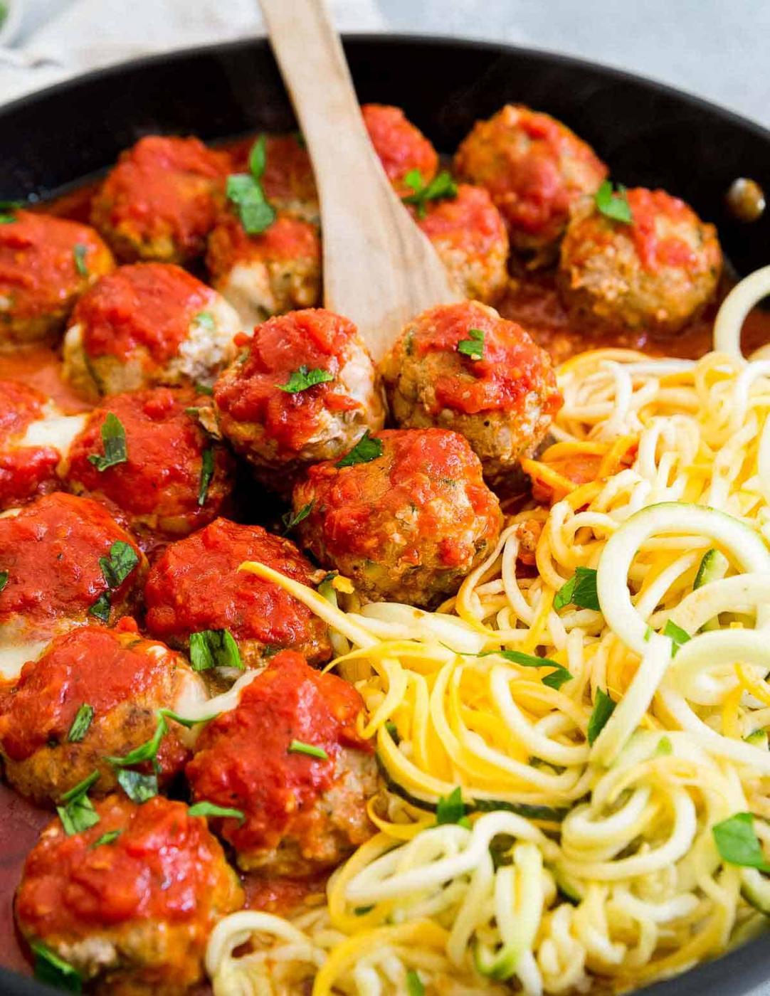 cheese stuffed turkey meatballs with zucchini and Italian seasoning cooked stovetop with marinara sauce.
