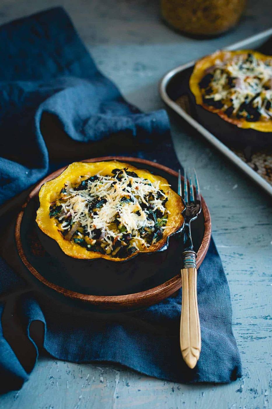 This twice baked acorn squash is stuffed with tuscan kale, hearty freekah and pecorino romano for a lovely fall side with a hidden protein boost.