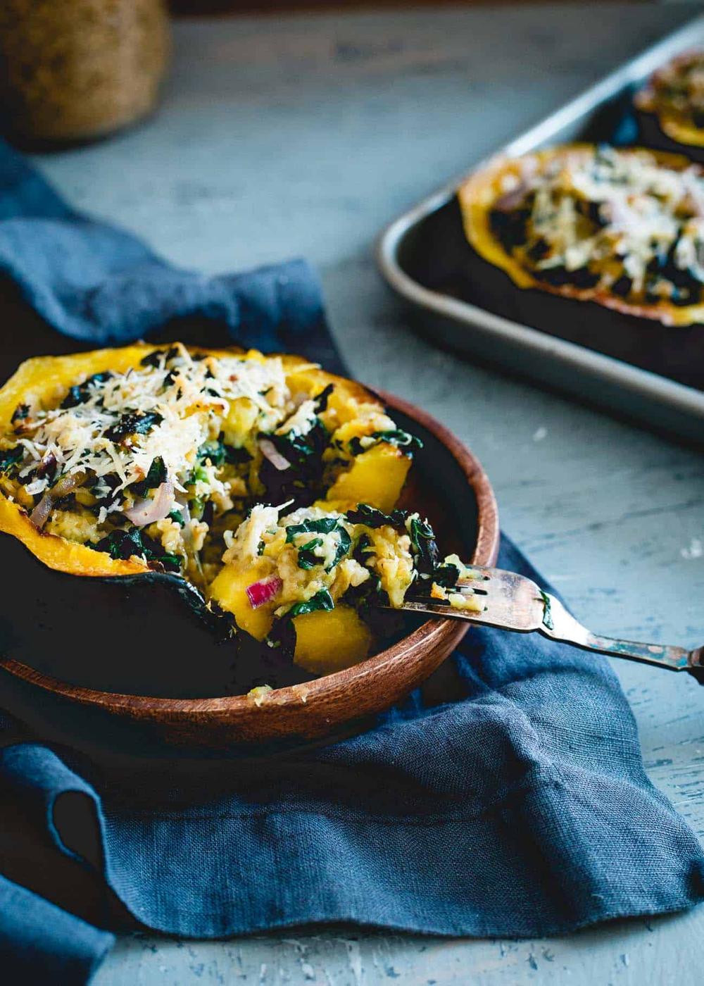 Cheesy, hearty and packed with healthy superfoods and protein, these twice baked acorn squash are a must for your fall dinner table!
