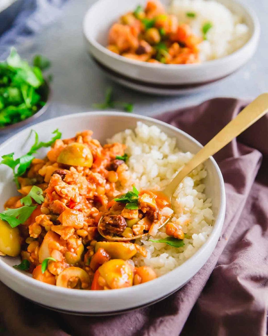 Vegan picadillo is a hearty Cuban recipe made with lentils and tempeh instead of the traditional beef for a plant based option.