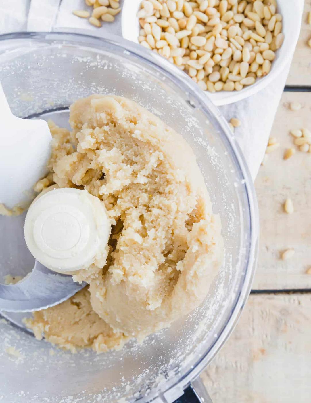 Pignoli cookie dough in a food processor.