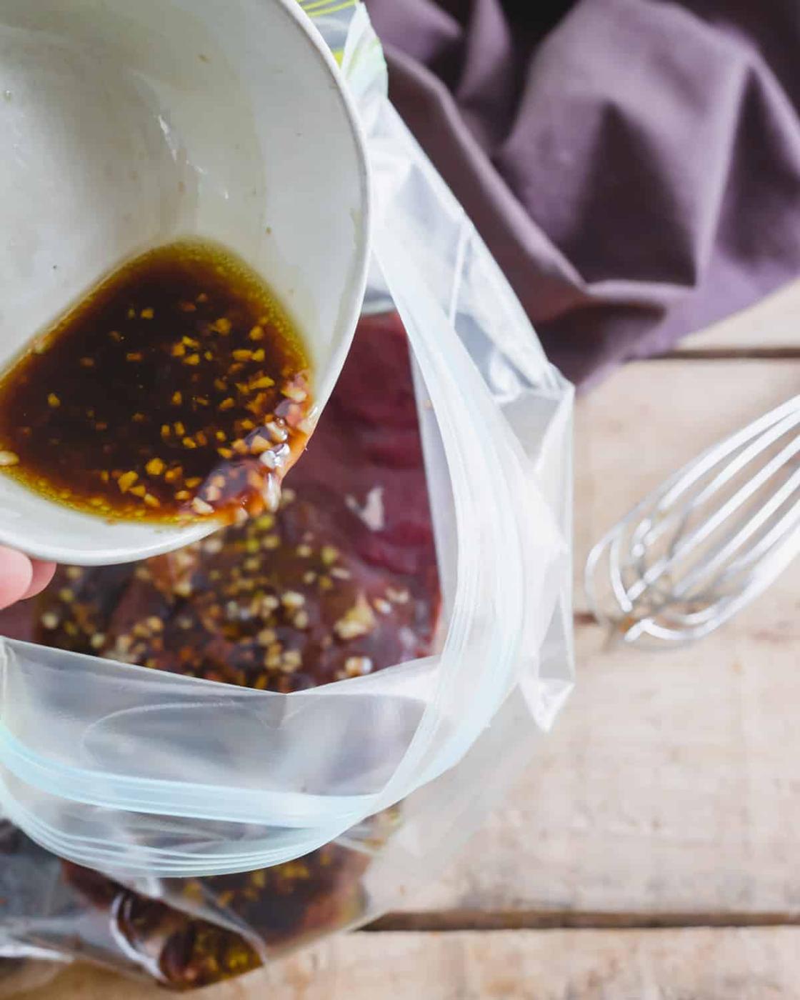 Quick and simple marinade for venison backstrap poured over venison in a plastic bag.
