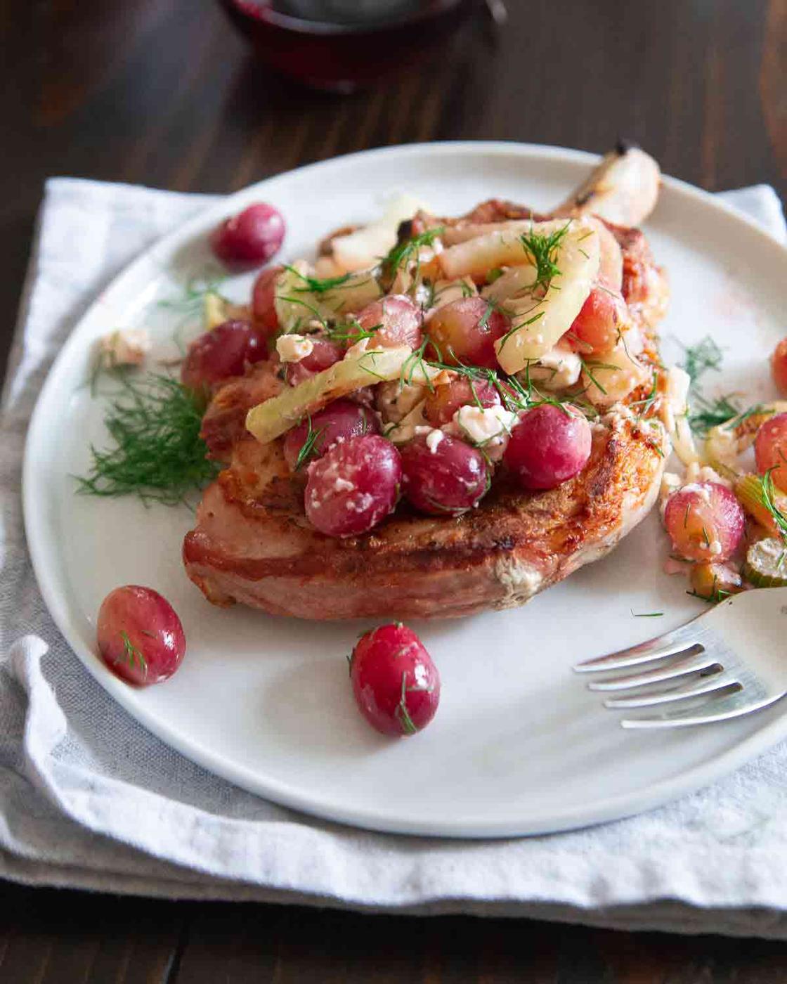 Looking for a meal to impress that's super easy and made all on the grill? Try these grilled pork chops with fennel and grapes.