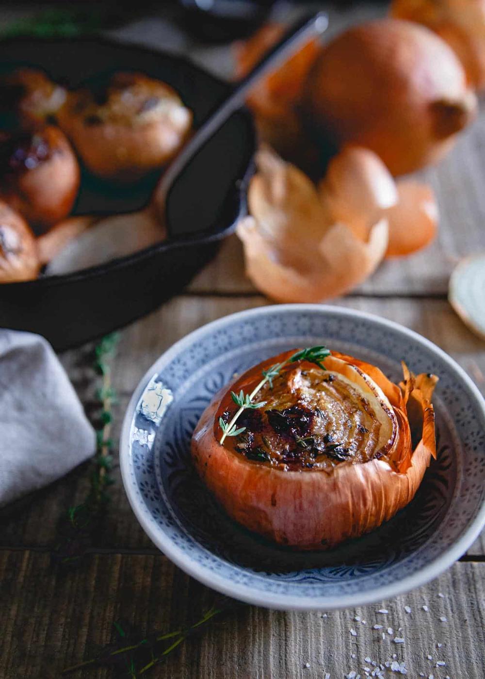 These whole roasted onions are seasoned with sweet balsamic vinegar and fresh thyme. The long roast time leaves them soft and buttery, almost melting in your mouth with each bite.