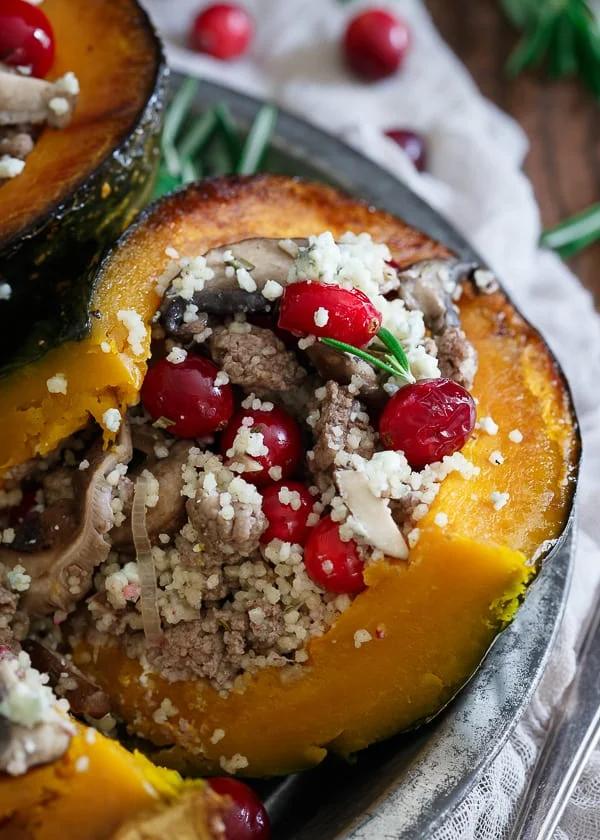 Stuffed kabocha squash with wild mushrooms, cranberries, lamb and blue cheese