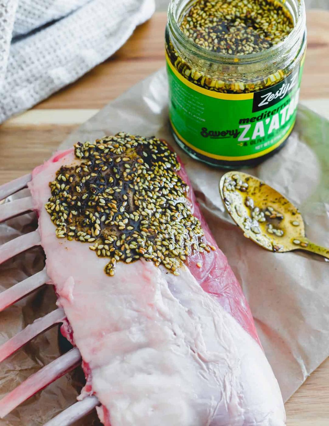 Za'atar spread on a rack of lamb as an easy seasoning.