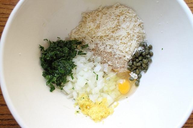 Quinoa patty ingredients in a large white mixing bowl.