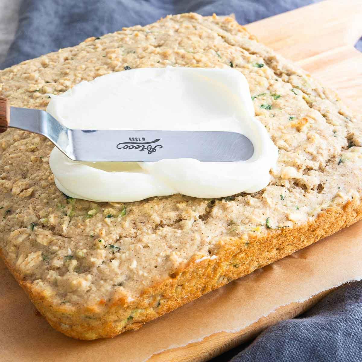 A healthier spin on the classic zucchini bar recipe with cream cheese icing.