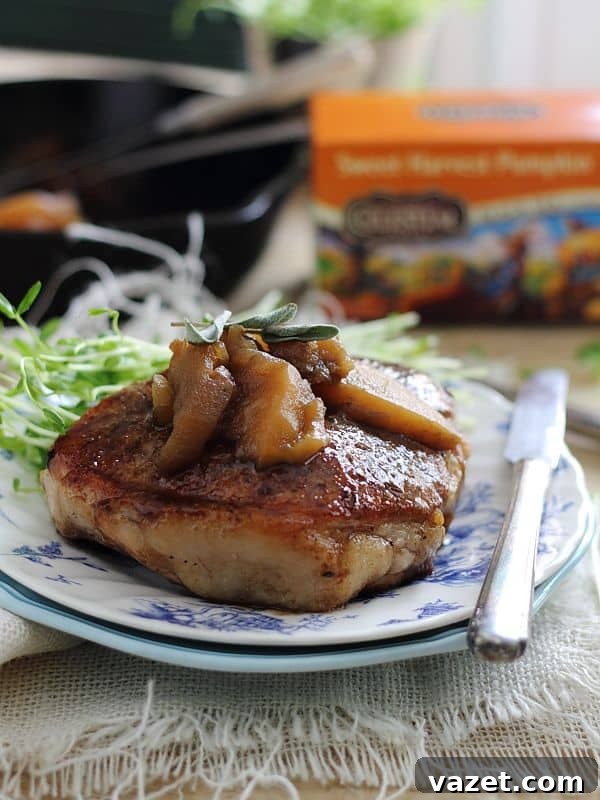 Tea glazed pork chops with apples, a close-up of the delicious meal.
