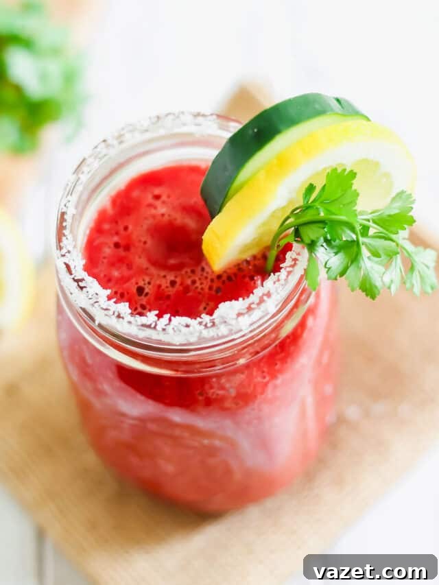 Juicing Decoded 3 A mason jar with a v8 drink and garnishes.
