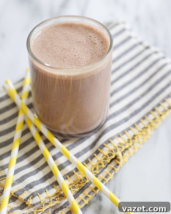 Thick and delicious chocolate cashew butter banana smoothie, perfect for breakfast or a hearty snack.