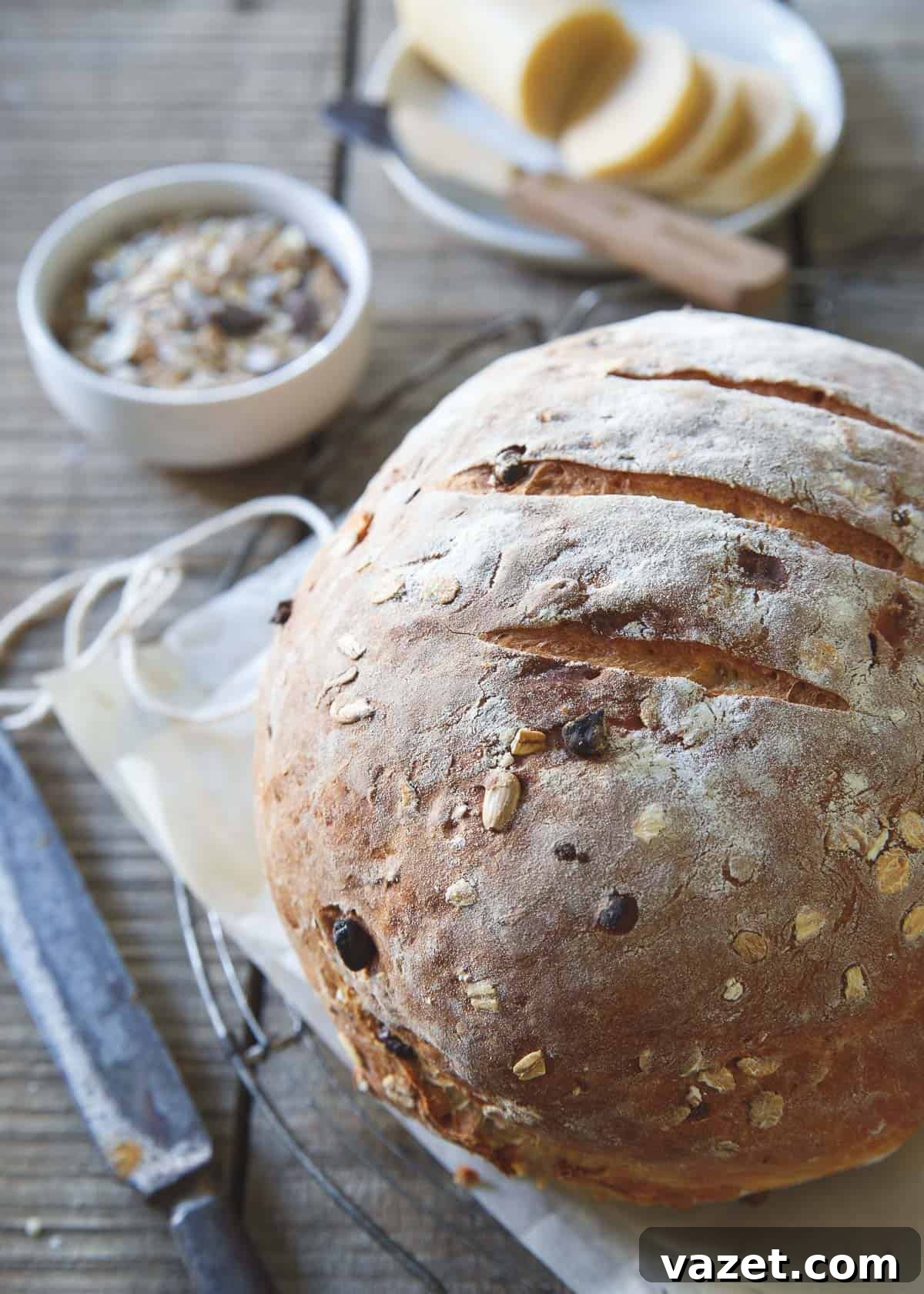 Muesli Loaf 2 A freshly baked loaf of muesli bread, sliced and ready to be enjoyed.