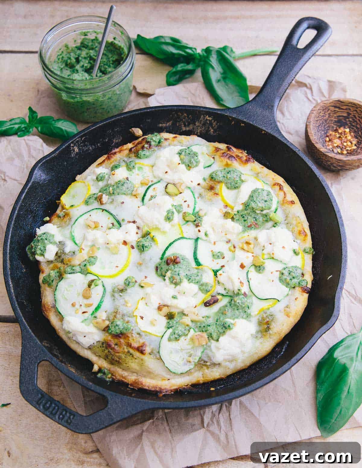 This skillet zucchini pesto pizza has a crispy yet chewy crust. With layers of tangy basil pesto, mozzarella, zucchini and ricotta it's perfect for summer! This skillet zucchini pesto pizza has a crispy yet chewy crust. With layers of tangy basil pesto, mozzarella, zucchini and ricotta it's perfect for summer!