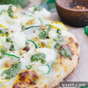Zucchini Pizza Boats 2 Zucchini pizza with white sauce and pesto.