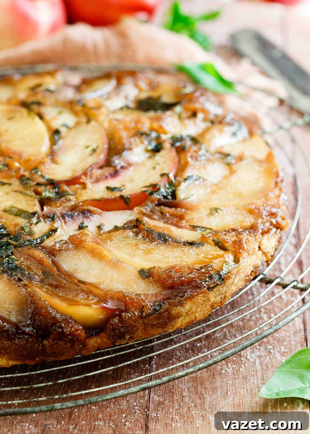 A slice of Gluten-Free Basil Nectarine Upside Down Cake, showcasing the caramelized nectarines and fresh basil, enhanced with Vital Proteins marine collagen.
