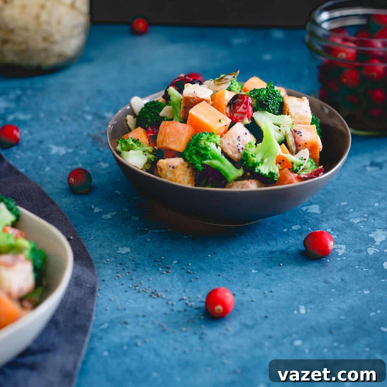 A small serving bowl showcases the vibrant cranberry broccoli salad, perfectly tossed in its creamy poppyseed cranberry dressing.