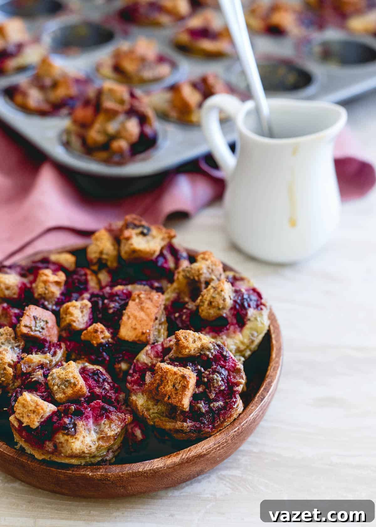 Delicious cinnamon raisin French toast bites with fresh blackberry ginger sauce, perfect for breakfast on the go.