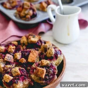 Mini French toast bites with blackberry ginger sauce.