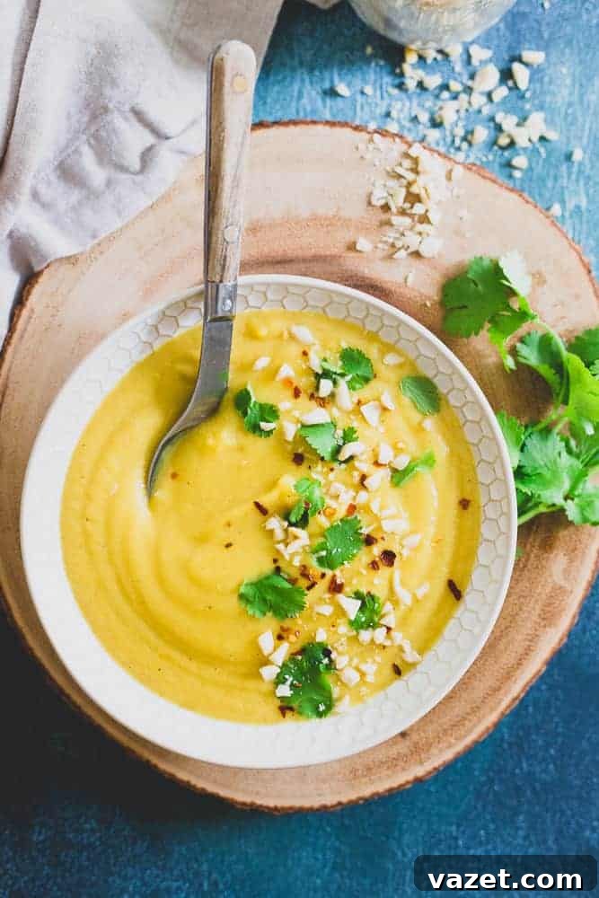 Coconut Milk: The Key to Light and Creamy Delicata Squash Soup with a Fresh Hint A swirl of coconut milk being incorporated into creamy delicata squash soup, highlighting its role in creating a rich texture.