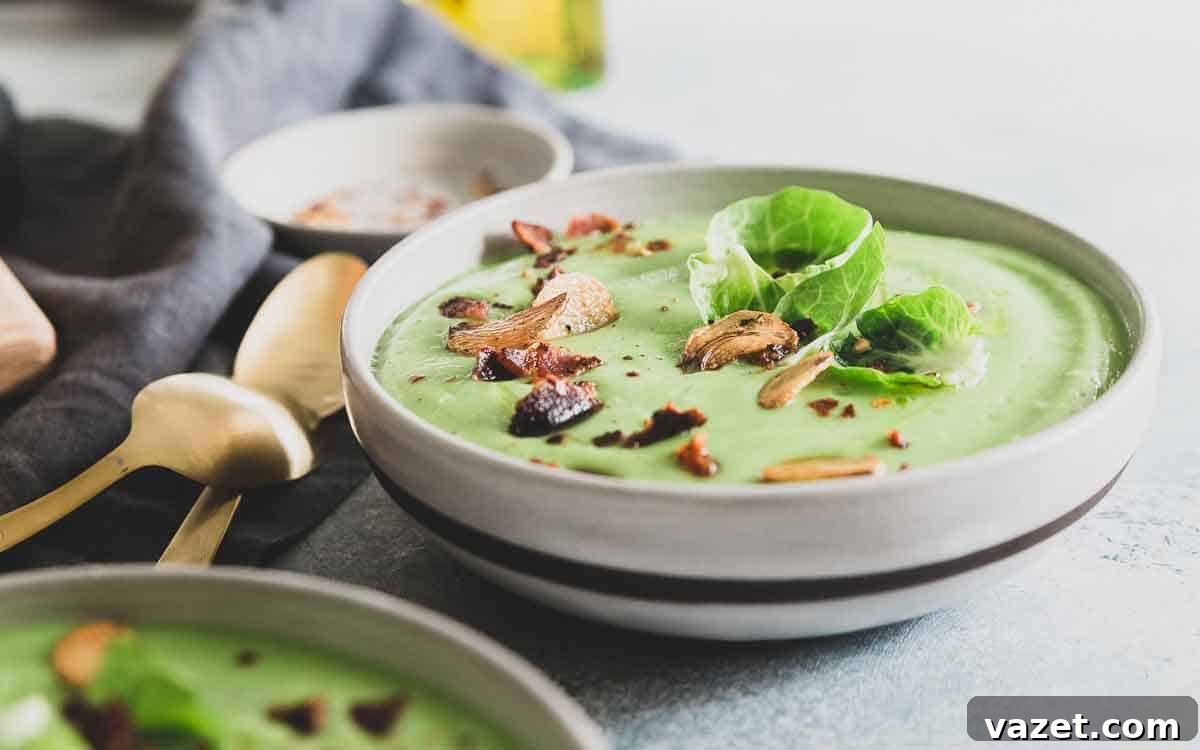 A healthy cream of Brussels sprout soup made with lots of garlic flavor and topped with crispy bacon for a delicious winter recipe!