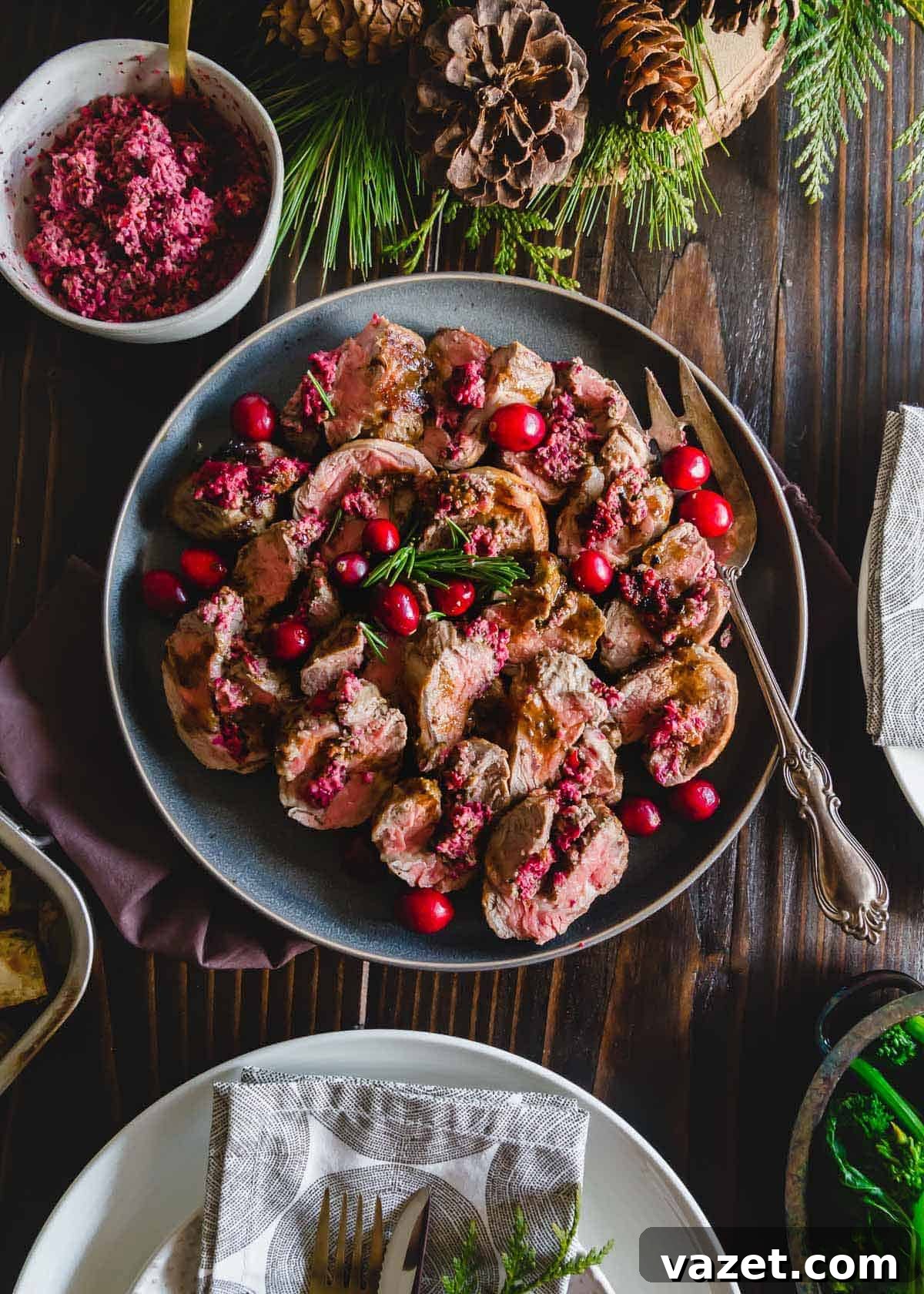 A simple cranberry pesto made with basil, mint, garlic and pine nuts makes this stuffed American lamb recipe a gorgeously festive and delicious winter dish perfect as a holiday dinner party centerpiece.