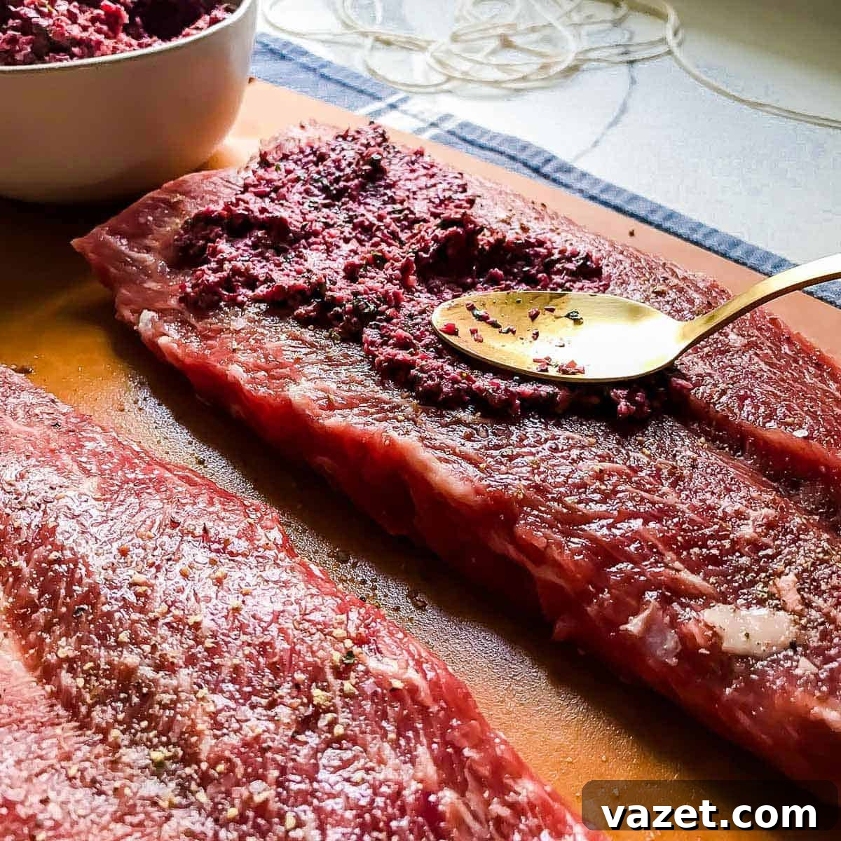 Butterflied lamb stuffed with cranberry pesto, ready for rolling and roasting.