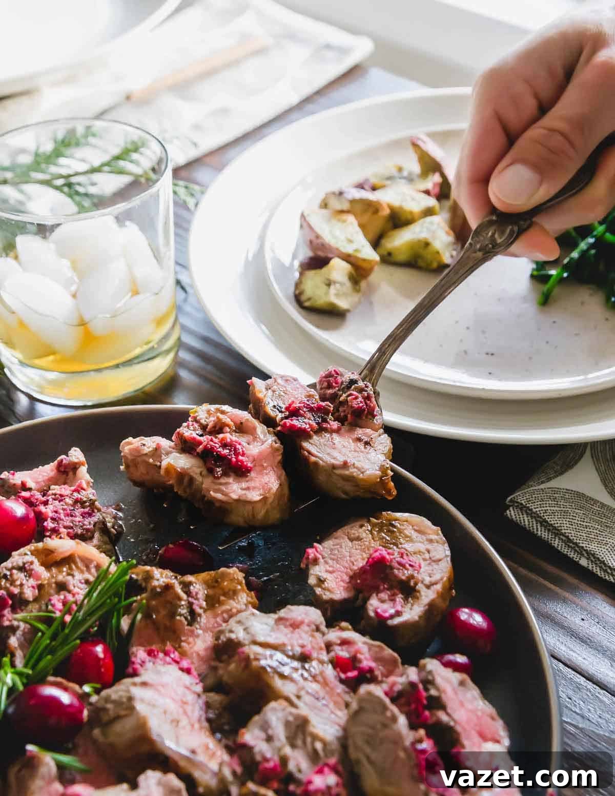 This stuffed lamb recipe uses tender lamb meat deboned from a rack of ribs and an easy to make cranberry pesto for bright, bold winter flavors.