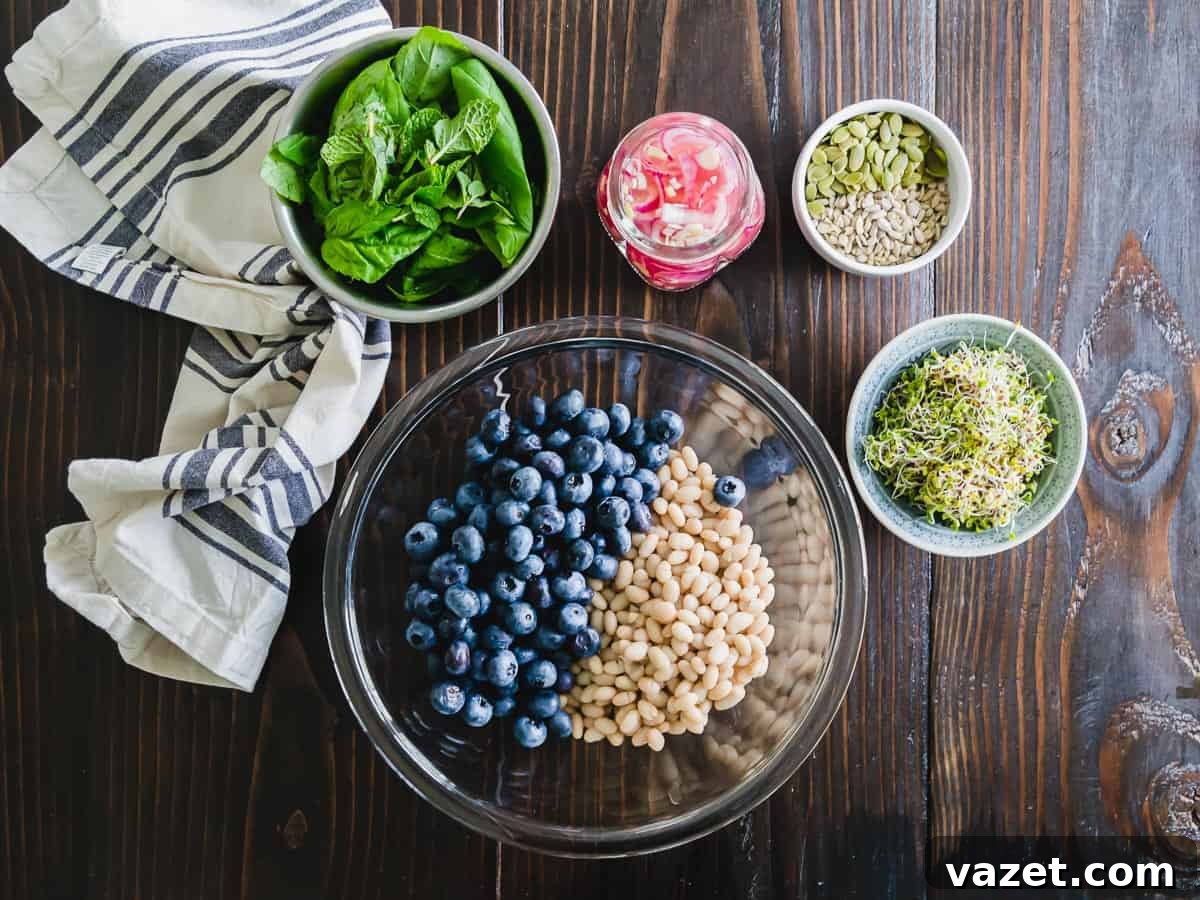 White bean and blueberry salad with pickled onions, seeds and fresh herbs.