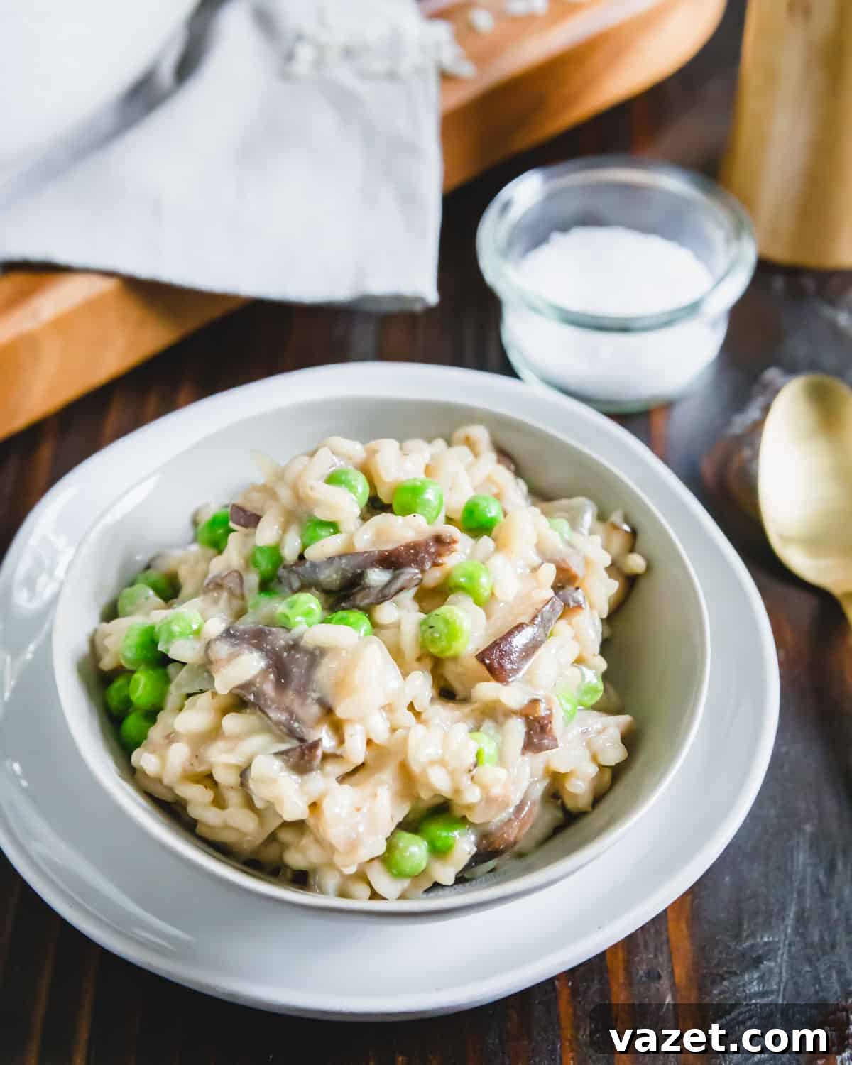 A bowl of creamy vegetarian and vegan mushroom risotto, prepared in under an hour, garnished with fresh herbs, ready to be enjoyed.