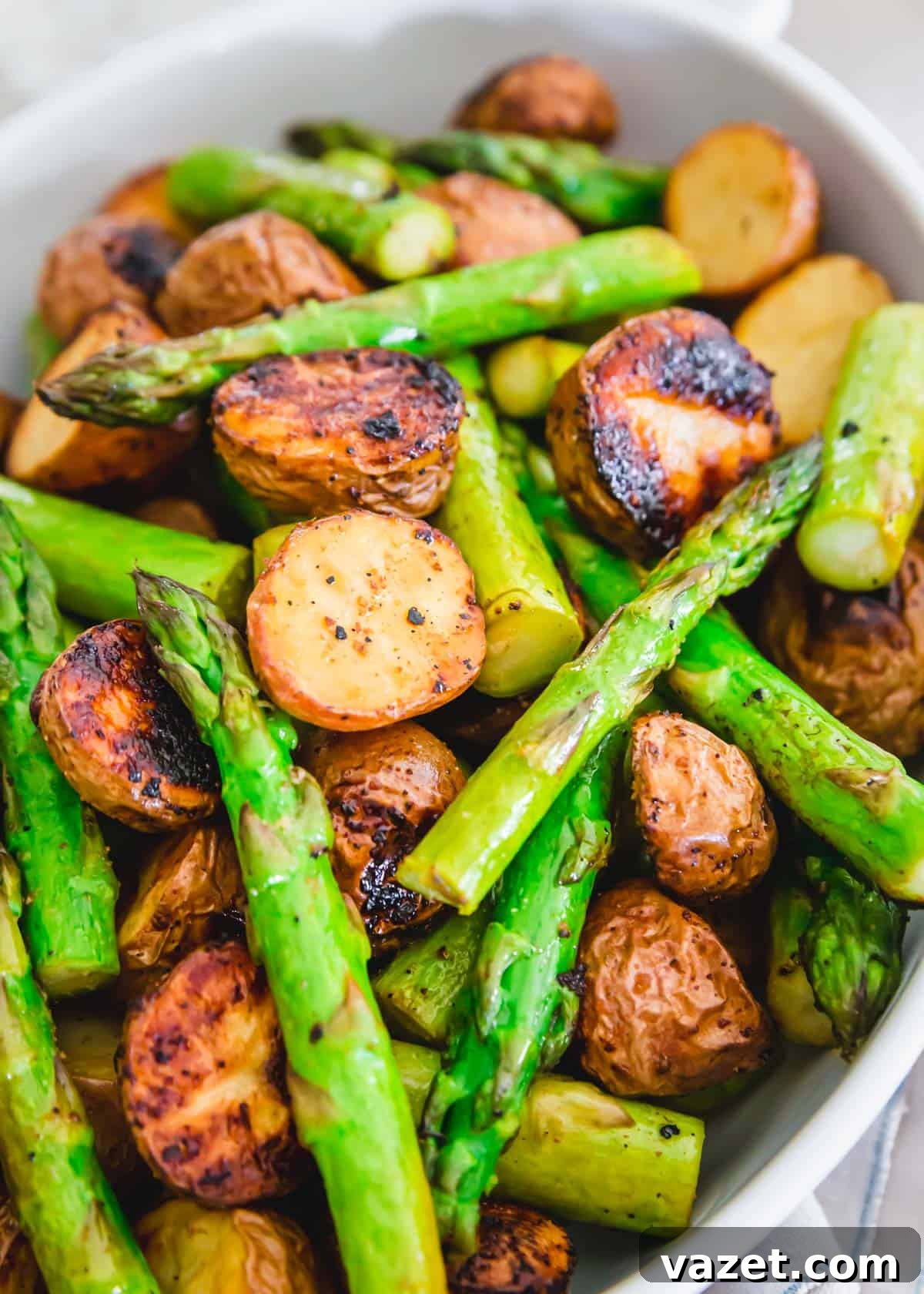 side dish of roasted potatoes and asparagus with garlic balsamic seasoning Side dish of roasted potatoes and asparagus with garlic balsamic seasoning
