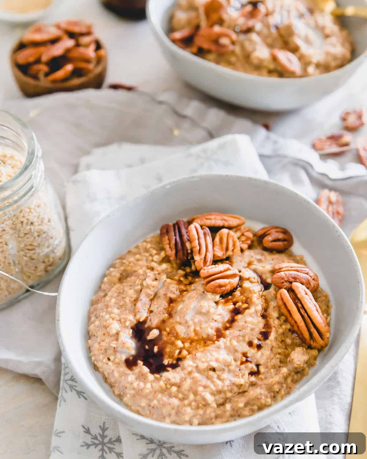 Stove-top Gingerbread Oatmeal with Steel Cut Oats and Molasses A bowl of creamy, cozy gingerbread steel cut oatmeal, garnished with pecans and a drizzle of molasses, perfect for a winter breakfast.