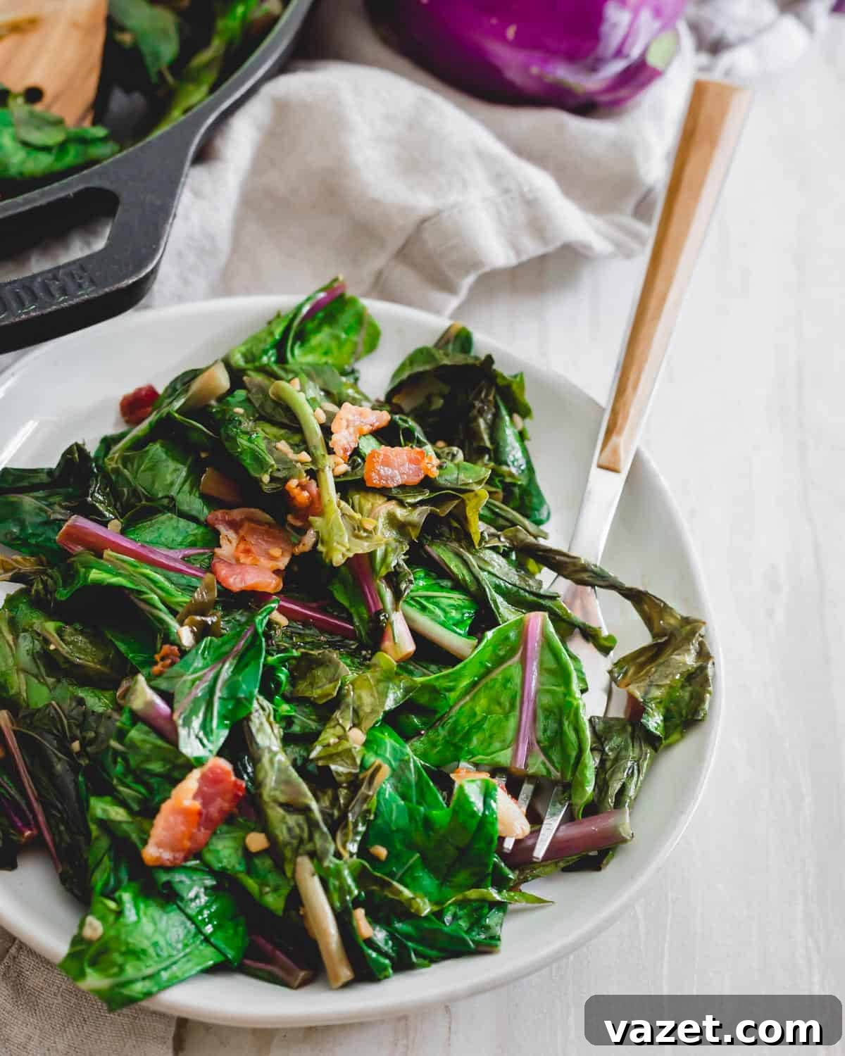 How to cook kohlrabi greens in a skillet with bacon, green onions and garlic. Ingredients laid out for cooking kohlrabi greens: chopped bacon, scallions, minced garlic, and fresh kohlrabi greens.
