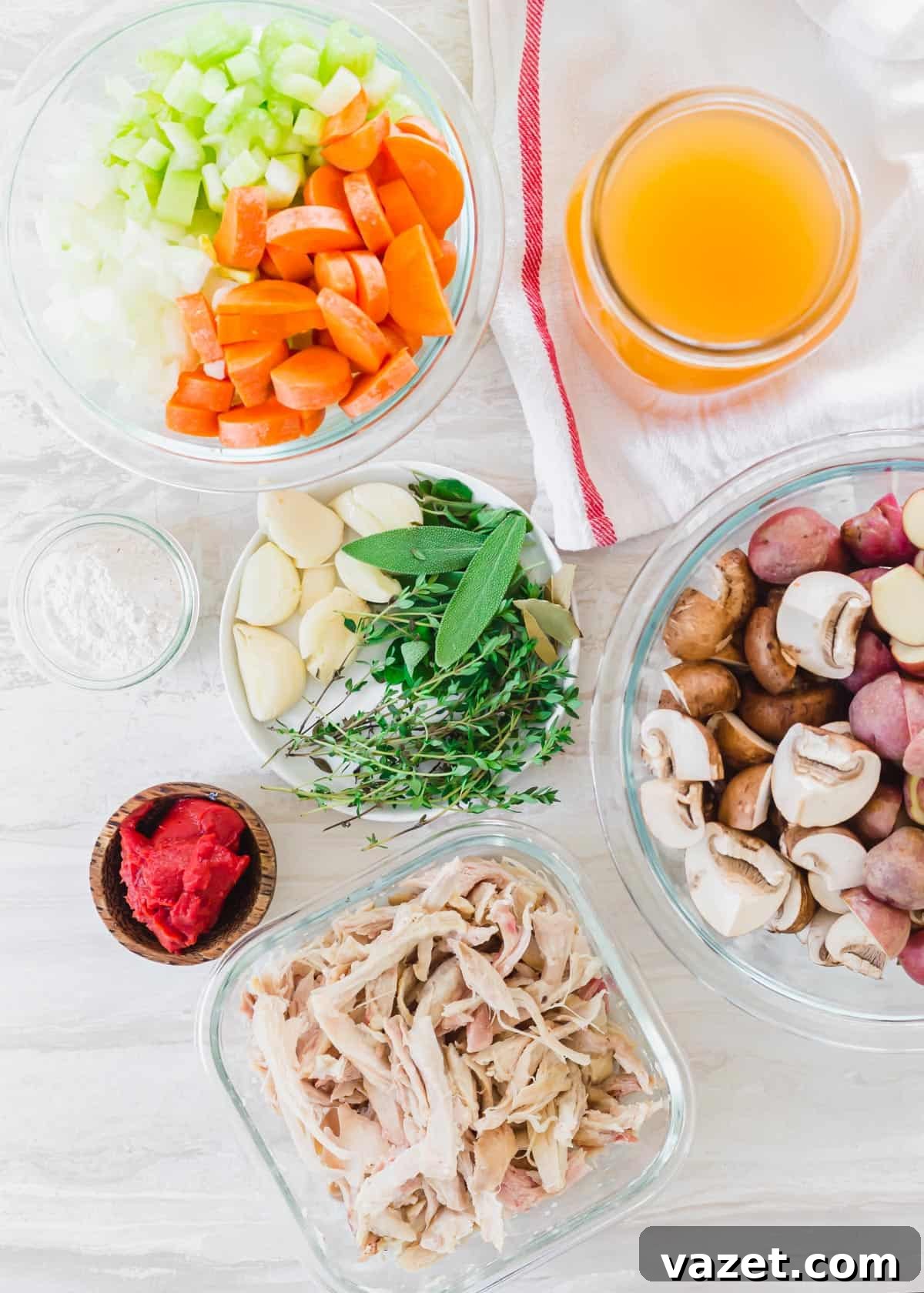 Ingredients to make turkey stew including red baby potatoes, mushrooms, tomato paste, garlic, fresh herbs, carrots, celery, onion, stock and shredded turkey. Ingredients for homemade turkey stew: red baby potatoes, mushrooms, tomato paste, garlic, fresh herbs, carrots, celery, onion, stock, and shredded cooked turkey.