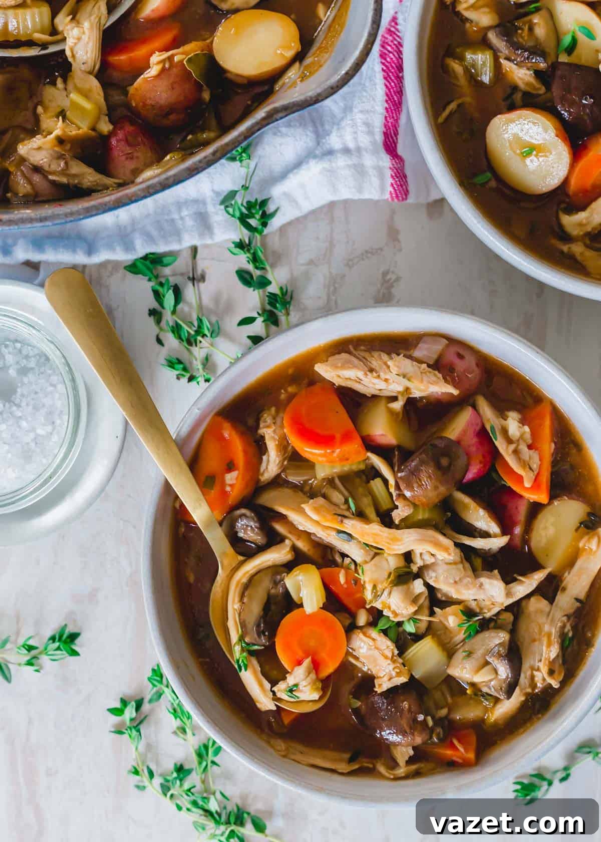 Thanksgiving leftover turkey stew in a bowl with a spoon. Thanksgiving leftover turkey stew served in a rustic bowl with a spoon.