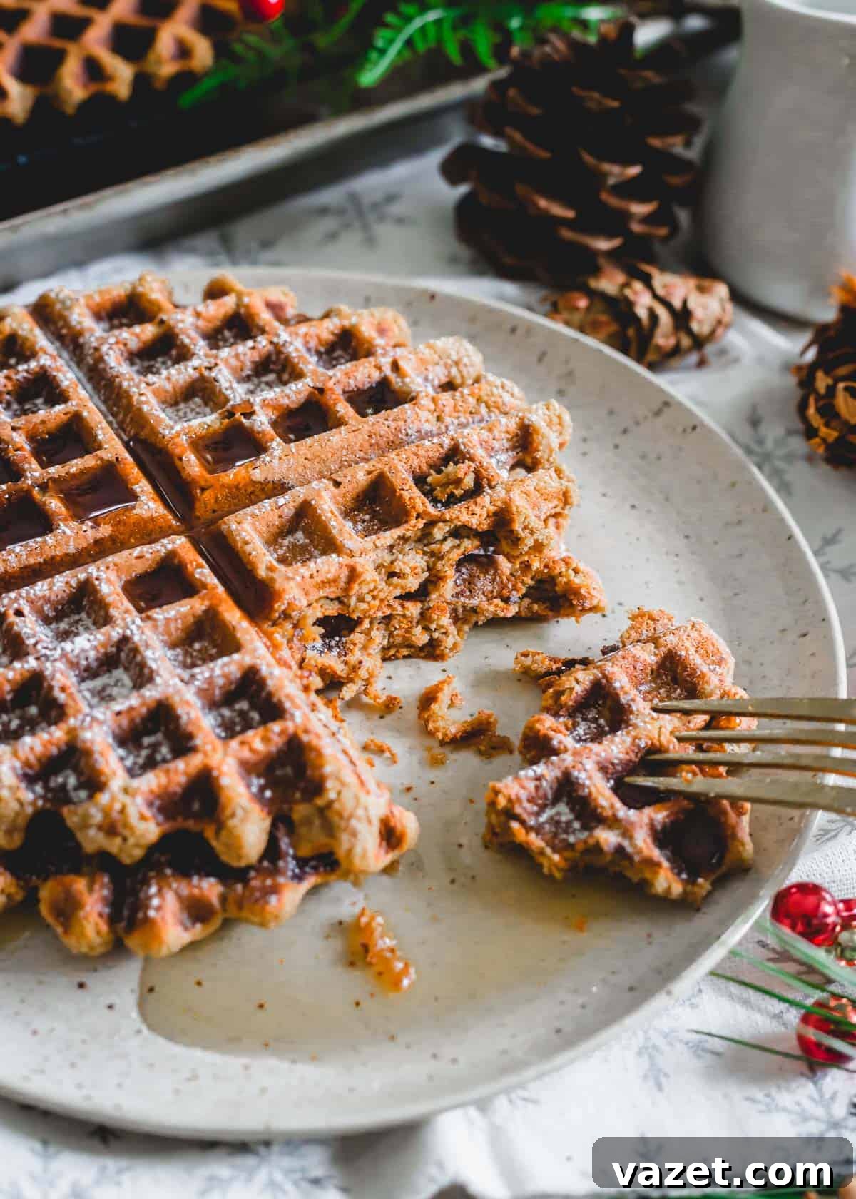 A close-up view of the tender, spiced interior texture of a gingerbread molasses waffle, revealing its wholesome grain.