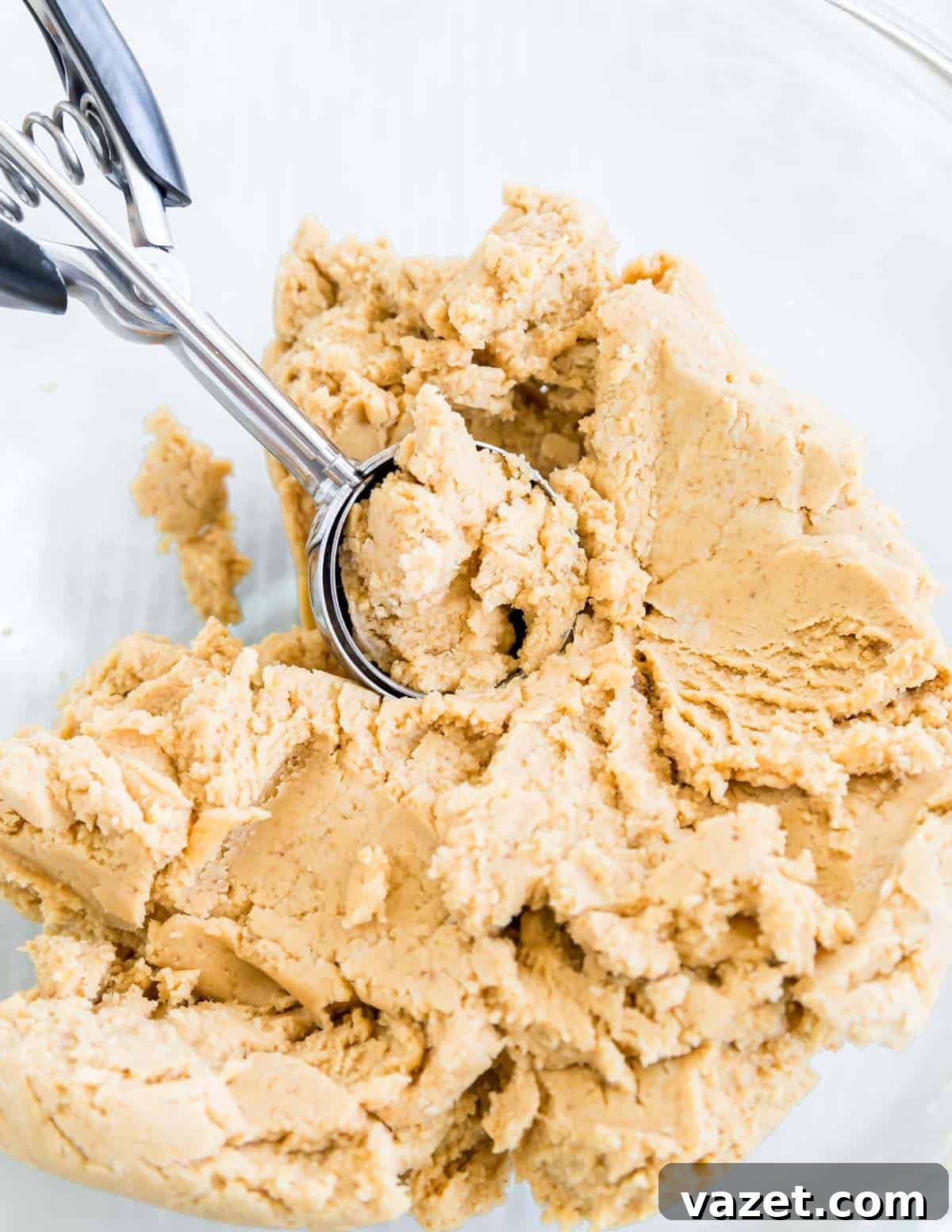 Flourless Peanut Butter Delights 4 Cookie scoop in a bowl with peanut butter cookie dough.