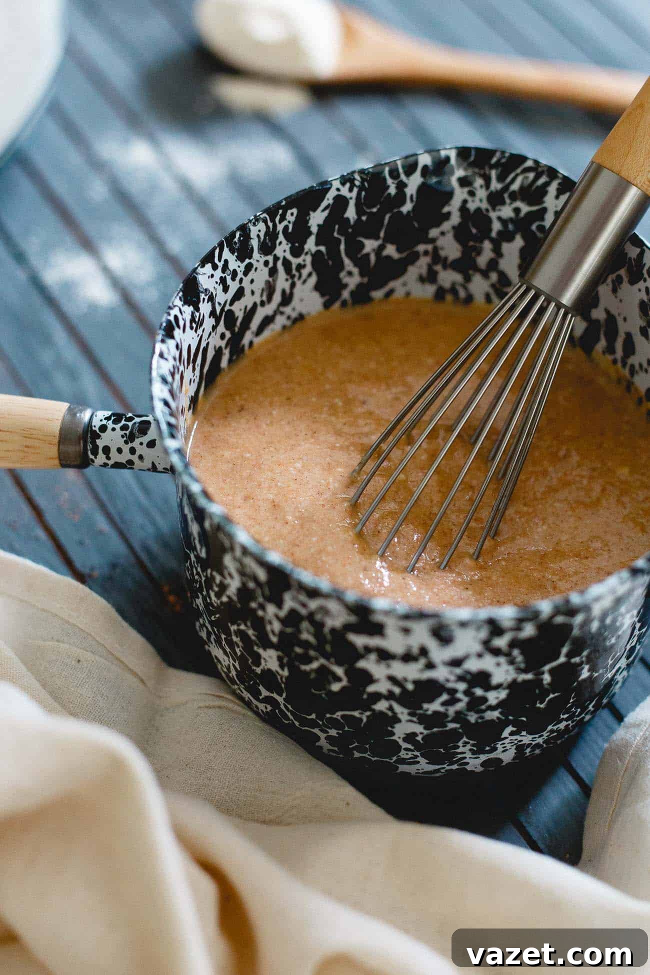 A stack of perfectly cooked pumpkin protein pancakes on a plate, ready for toppings, highlighting an easy and healthy fall breakfast.
