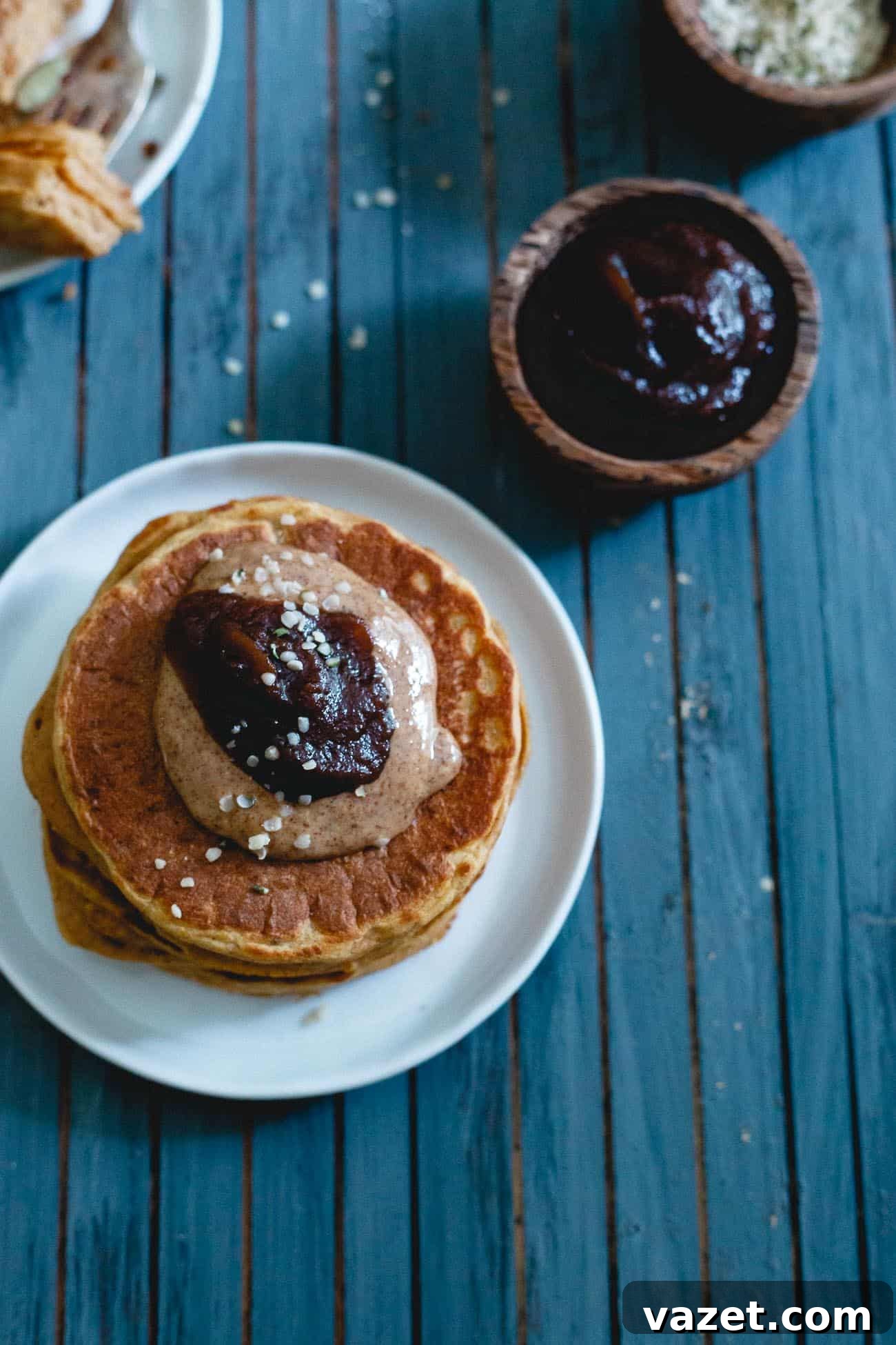 A beautifully styled shot of pumpkin protein pancakes, emphasizing their warmth and deliciousness, perfect for a crisp fall morning.