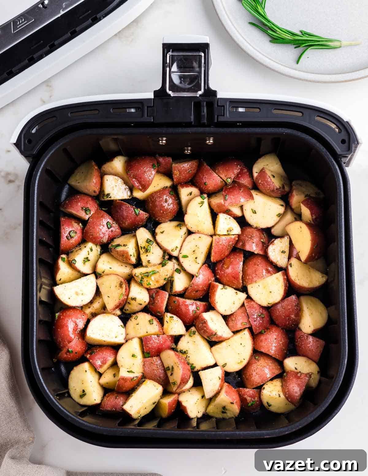 Red potatoes in an air fryer.