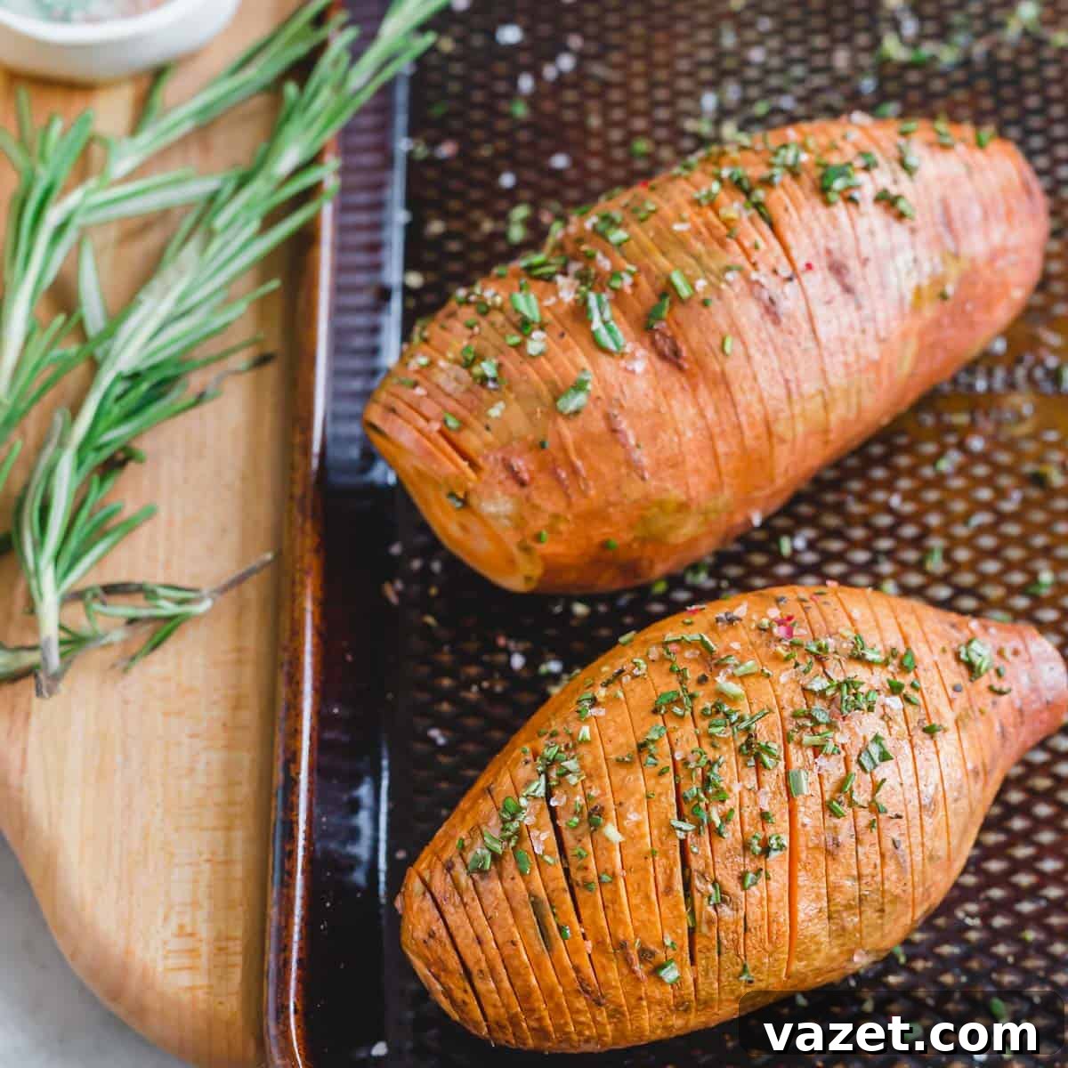 Hasselback sweet potatoes on a baking sheet ready to be roasted. Hasselback sweet potatoes on a baking sheet ready to be roasted.