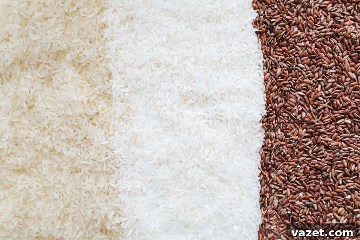 A Rice Odyssey Discovering Grains Beyond Basmati 5 Top view of different types of rice grains arranged in two halves forming a diagonal division on a flat surface.