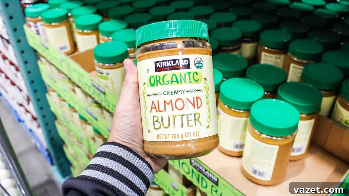 Smart Substitutes for Tahini 3 A person holding a jar of almond butter.