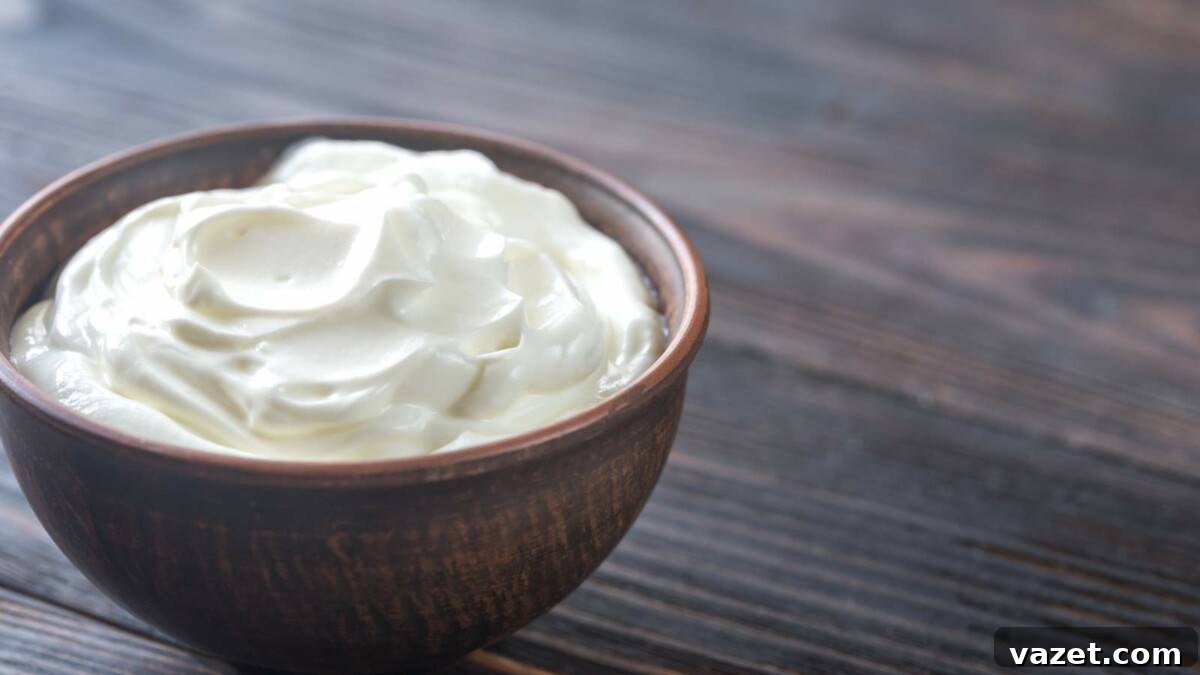 Smart Substitutes for Tahini 4 Whipped cream in a wooden bowl on a wooden table.