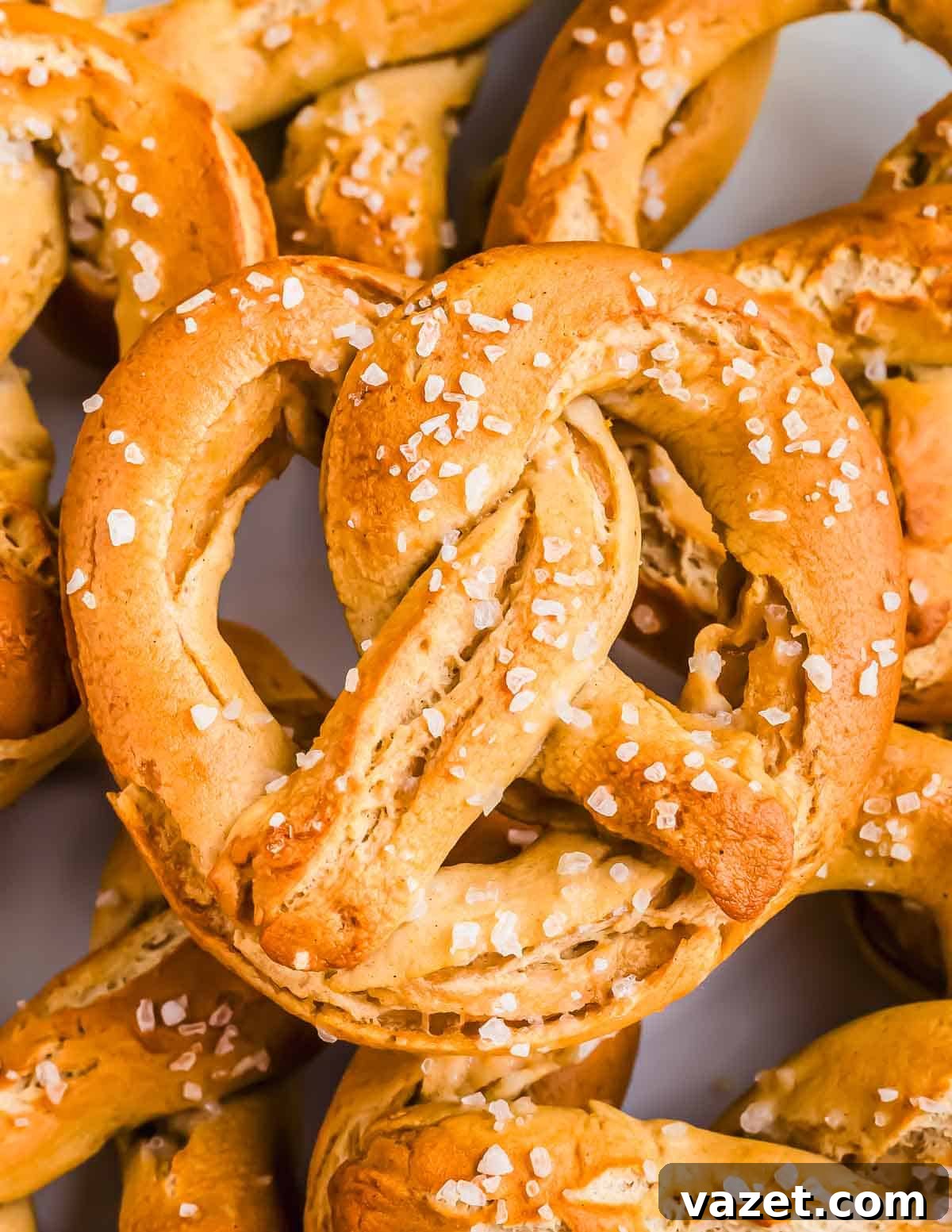 Cloud-Soft Gluten-Free Pretzels 2 A close-up of several freshly baked soft GF pretzels sprinkled with coarse salt.