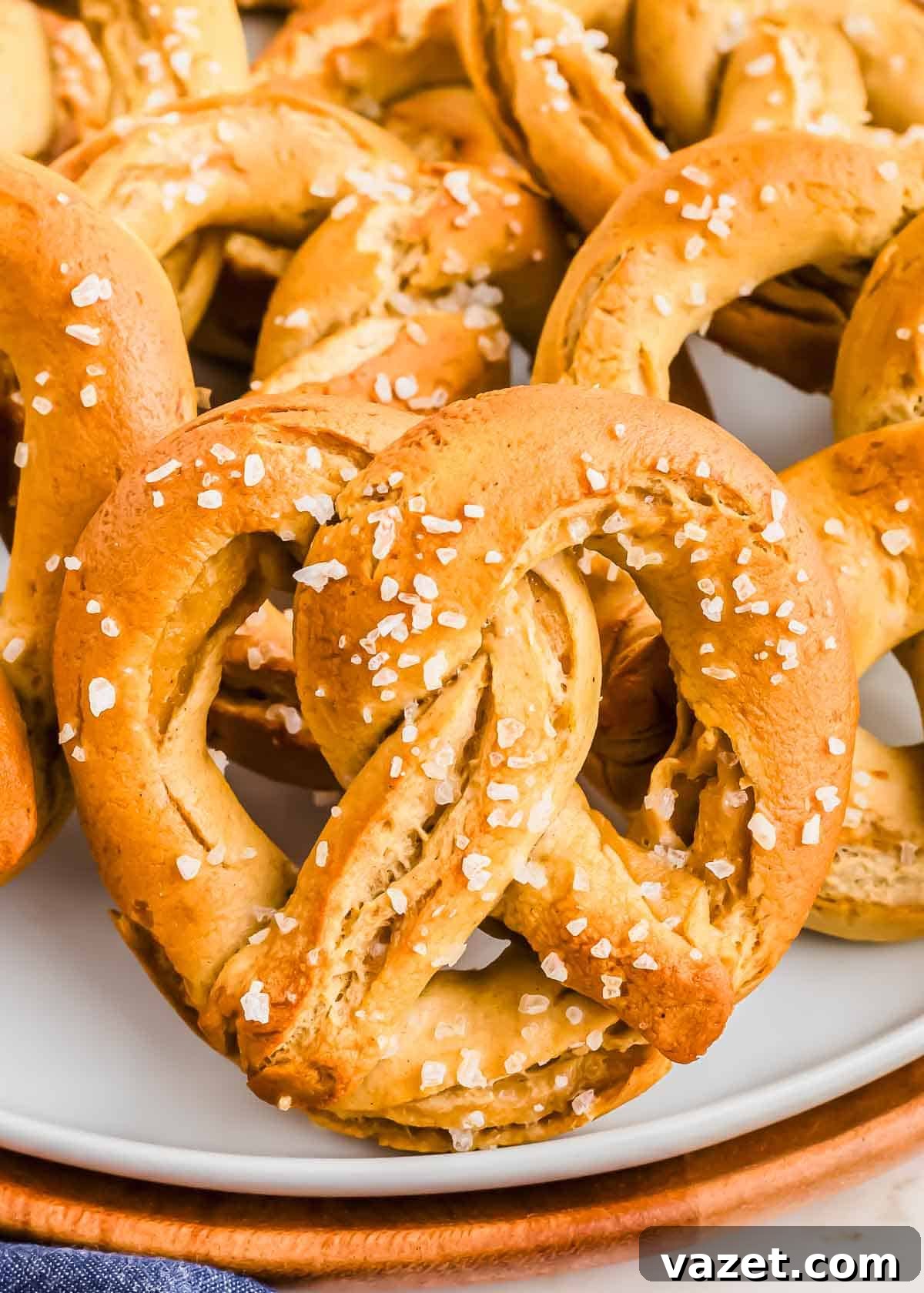Cloud-Soft Gluten-Free Pretzels 3 A plate filled with freshly baked soft pretzels topped with coarse salt.
